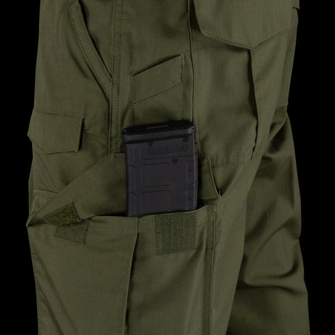 A black rifle magazine is partially inserted into a side pocket of the Condor Sentinel Tactical Pants in green.