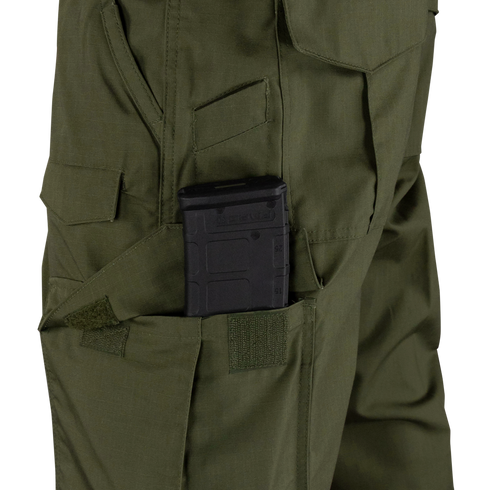 A black rifle magazine is partially inserted into a side pocket of the Condor Sentinel Tactical Pants in green.