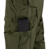 A black rifle magazine is partially inserted into a side pocket of the Condor Sentinel Tactical Pants in green.