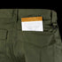 A small notepad partially tucked into the back pocket of Condor Sentinel Tactical Pants.