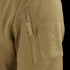 Close-up of the Condor Summit Zero Softshell Jacket’s tan sleeve, highlighting a vertical zipper pocket and a rectangular hook-and-loop patch.