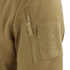 Close-up of the Condor Summit Zero Softshell Jacket’s tan sleeve, highlighting a vertical zipper pocket and a rectangular hook-and-loop patch.