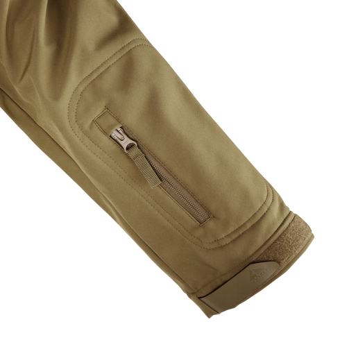 A close-up of the Condor Summit Zero Softshell Jacket in khaki shows its sleeve with a zippered pocket and hook-and-loop fastener at the cuff.