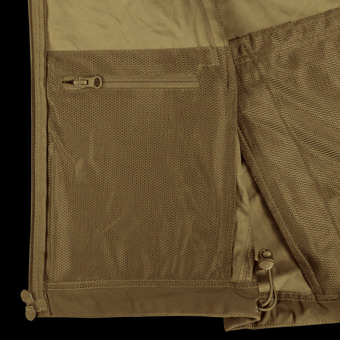 Close-up of the Condor Summit Zero Softshell Jacket in brown, featuring a mesh zip pocket and an adjustable drawstring at the hem.