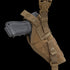 The Condor Vertical Shoulder Holster secures a black handgun in a brown tactical holster with straps and snap buttons, designed for attachment to gear or clothing.