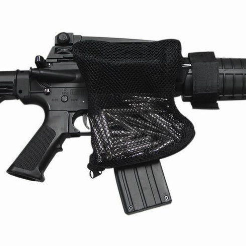 A Condor M4/M16 Brass Catcher, in black mesh, is attached to a semi-automatic rifle to collect spent shell casings during firing.