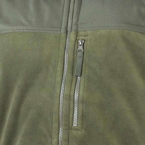 Close-up of the Condor Alpha Fleece Jacket in green, highlighting the visible vertical chest zipper pocket and a portion of the main front zipper.