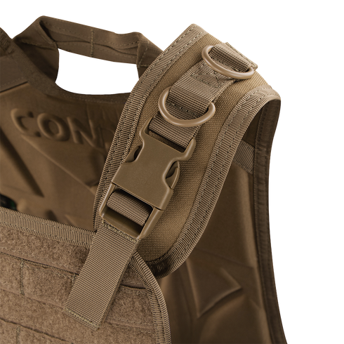 Close-up of the Condor Compact Plate Carrier’s shoulder strap, showing a plastic buckle, dual metal D-rings, and reinforced stitching on brown fabric—perfect for law enforcement or EDC use.