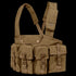 The Condor 7-Pocket Chest Rig is a tan tactical chest rig featuring adjustable shoulder straps and seven front pouches secured with buckles and flaps.