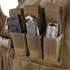 The Condor Cross Draw Vest features three pouches for carrying a magazine, a folding knife, and a flashlight.