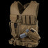 The Condor Cross Draw Vest is a tan tactical vest for military or EDC use, featuring multiple pouches, pockets, holsters—including a holstered handgun and magazine holders—displayed upright.
