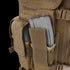 Close-up of a Condor Cross Draw Vest featuring two silver rifle magazines partially visible in brown fabric pouches with Velcro flaps, designed for tactical use.