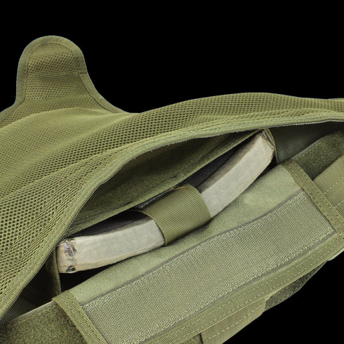 Close-up of the Condor Defender Plate Carrier in olive green, with an armor plate partially visible inside the front compartment.