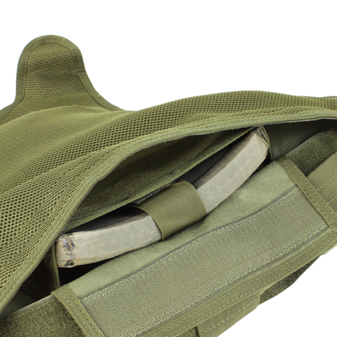 Close-up of the Condor Defender Plate Carrier in olive green, with an armor plate partially visible inside the front compartment.