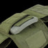A close-up of the Condor Defender Plate Carrier in green, featuring an open pocket that reveals a ballistic plate inside.