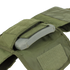A close-up of the Condor Defender Plate Carrier in green, featuring an open pocket that reveals a ballistic plate inside.