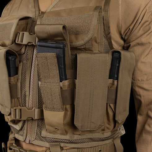 A person wears the Condor Elite Tactical Vest, featuring multiple pouches holding three black rifle magazines—ideal for EDC or law enforcement at the shooting range.