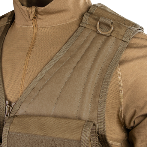 Close-up of a person wearing the Condor Elite Tactical Vest over a matching zippered uniform, highlighting sturdy shoulder straps and a metal D-ring—ideal for law enforcement or EDC use.