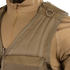 Close-up of a person wearing the Condor Elite Tactical Vest over a matching zippered uniform, highlighting sturdy shoulder straps and a metal D-ring—ideal for law enforcement or EDC use.