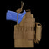 A Condor Ambidextrous Holster - Beretta in brown, featuring straps and MOLLE webbing, holds a blue training pistol and is shown from the side.
