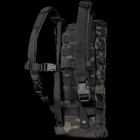 The Condor Hydration Carrier in MultiCam Black features adjustable shoulder straps and multiple attachment points, displayed against a white background.