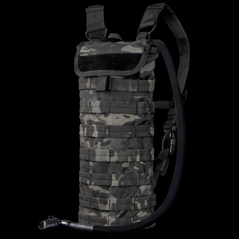 The Condor Hydration Carrier in MultiCam Black features a camouflage pattern, adjustable shoulder straps, and an attached drinking tube for convenient hydration on the go.