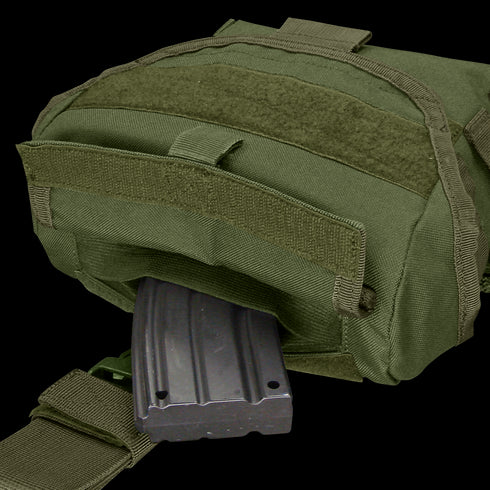 A Condor Drop Leg Dump Pouch in green, featuring a Velcro flap, is shown partially open with a black rifle magazine visible inside.