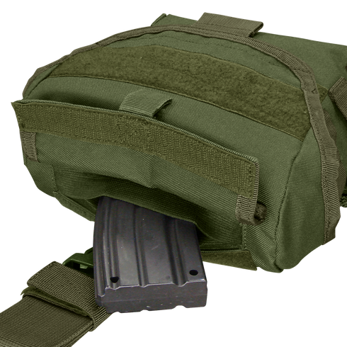 A Condor Drop Leg Dump Pouch in green, featuring a Velcro flap, is shown partially open with a black rifle magazine visible inside.