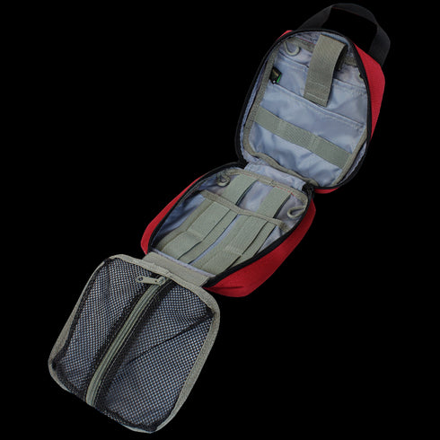 The Condor Rip-Away EMT Pouch in MultiCam is open, showing gray interior compartments, elastic straps, and a zippered mesh pocket—ideal for organizing bushcraft tools or shooting range essentials.