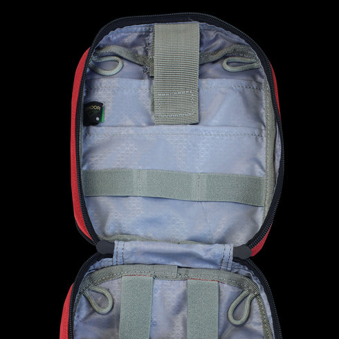 The Condor Rip-Away EMT Pouch features a light gray interior, multiple elastic straps, and loops for organizing small items in an open, empty zippered pouch.
