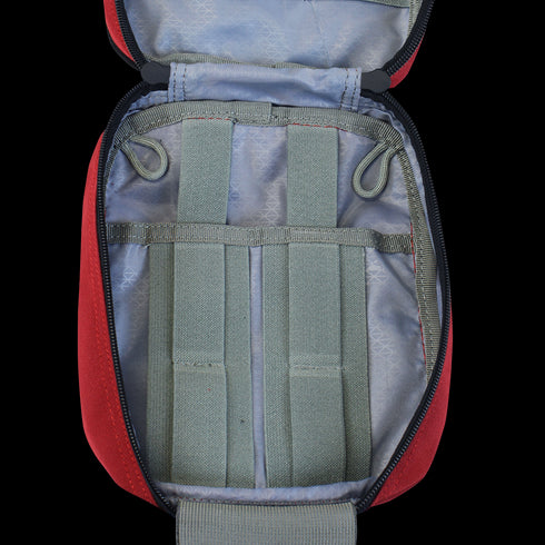 The Condor Rip-Away EMT Pouch in MultiCam features a red interior with grey elastic straps and loops, ideal for organizing small tools—perfect for First Responders or Law Enforcement at the range.