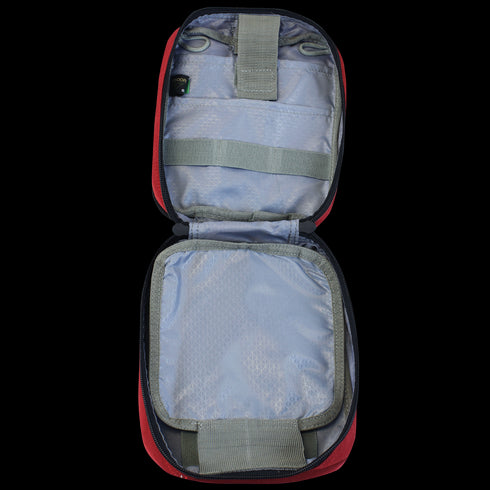 The Condor Rip-Away EMT Pouch is shown open and empty, displaying elastic loops and mesh pockets for organized storage inside.