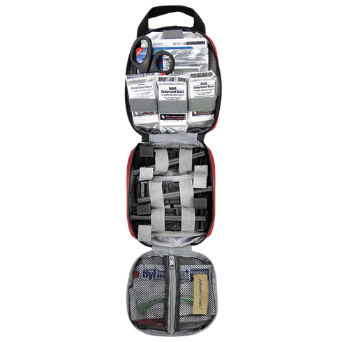 The Condor Rip-Away EMT Pouch opens to reveal scissors, bandages, gauze packs, medical tape, and various supplies neatly organized in mesh and elastic compartments.