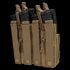 The Condor Double Stacker M4 Mag Pouch is a tan MOLLE pouch that securely holds four black rifle magazines with snap closures.
