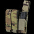 Condor Triple Pistol Mag Pouch in Scorpion OCP camo holds two black rectangular magazines, one partially visible and secured by a Velcro strap.