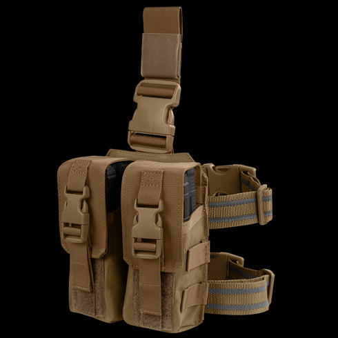 The Condor Drop Leg M4 Mag Pouch in coyote brown features two compartments, buckles, and adjustable straps—perfect for carrying gear or magazines.