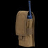 The Condor Radio Pouch is a tan nylon case with a flap cover, designed to hold a blue handheld radio.