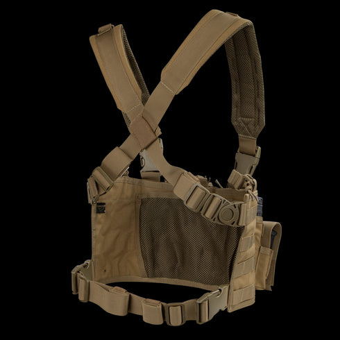 The Condor Recon Chest Rig features a tan color, adjustable straps, mesh back panel, and multiple attachment points for gear and accessories.