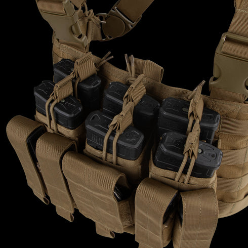 The Condor Recon Chest Rig in tan features multiple pouches with elastic cords, securely holding several black rifle magazines.