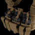The Condor Recon Chest Rig in tan features multiple pouches with elastic cords, securely holding several black rifle magazines.