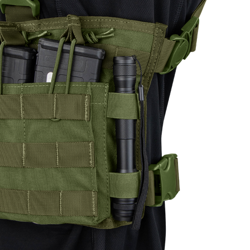 A close-up of the Condor Rapid Assault Chest Rig shows two rifle magazines and a black flashlight secured in green pouches, with visible straps and buckles.
