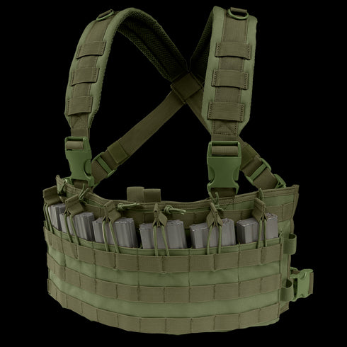 The Condor Rapid Assault Chest Rig in Olive Drab features adjustable shoulder straps, multiple magazine pouches, and MOLLE webbing, shown holding several gray rifle magazines.