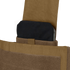 A close-up of a black ballistic plate partially inserted into the pocket of a tan Condor Modular Operator Plate Carrier Gen II.