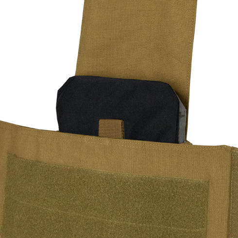A black ballistic plate, ideal for EDC or first responders, is partially inserted into the pocket of a Condor Modular Operator Plate Carrier Gen II in Scorpion OCP.