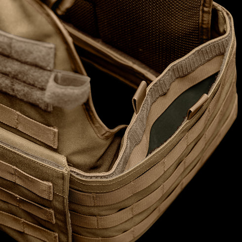 Close-up of the Condor Modular Operator Plate Carrier Gen II in tan, featuring MOLLE webbing and an open compartment displaying the inner padding or plate insert.