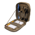 The Condor Sidekick Pouch in khaki opens to reveal pens, a flashlight, a multitool, a whistle, a pencil, and a notepad neatly secured with interior elastic straps.
