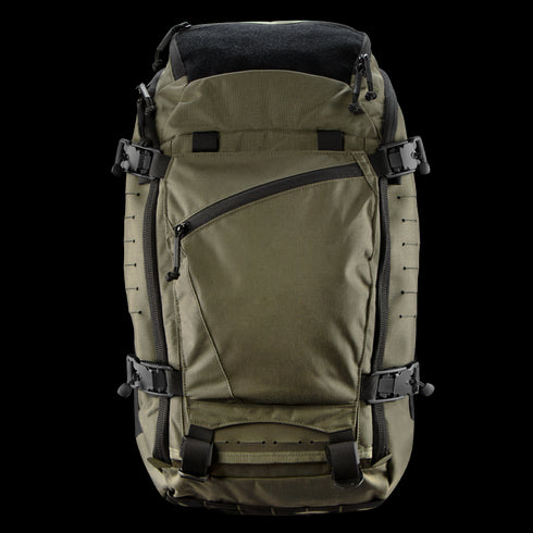 The Condor Nomad Backpack 25L in olive green features multiple straps, black buckles, a front zippered pocket, and a slightly open top showing the black interior—perfect for EDC or shooting range trips.