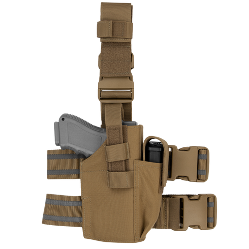 The Condor Tactical Leg Holster features adjustable straps and securely holds a grey training pistol and black flashlight, making it ideal for shooting range practice or military use.