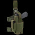 The Condor Tornado Tactical Leg Holster - Left Hand in Olive Drab features a secured gray training pistol, retention system, extra magazine pouch, and adjustable straps with buckles for easy attachment.