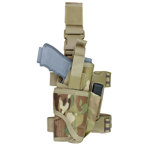 The Condor Tornado Tactical Leg Holster - MultiCam securely holds a gray training pistol and a magazine, featuring adjustable straps and plastic buckles for a customizable fit.